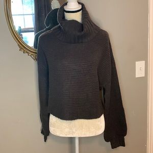 Elan cris cross open backed turtle neck sweater.